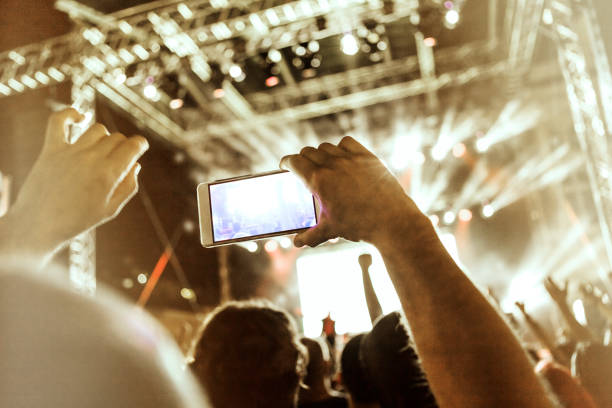 istock Fan filming live show 958222850
