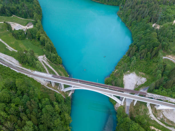 istock Railway bridge crossing the dammed Steyr river, Austria 958229162