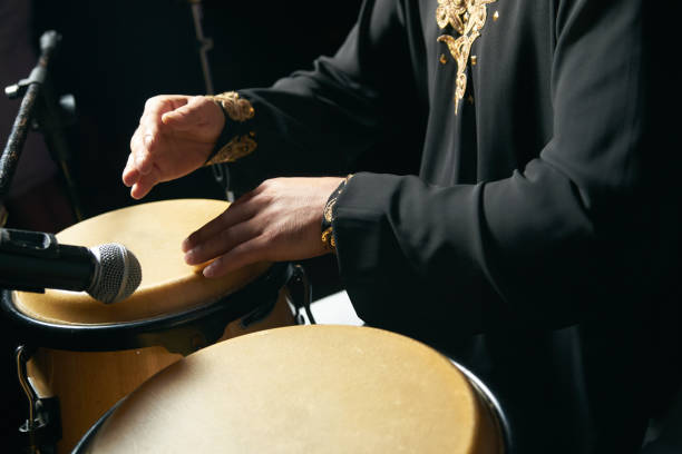 istock Man hands playing music at djembe drums 958229230