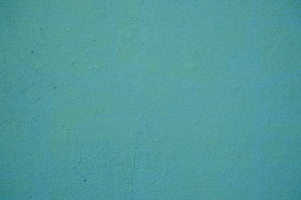 istock Green stucco wall background, painted cement wall texture 958235996