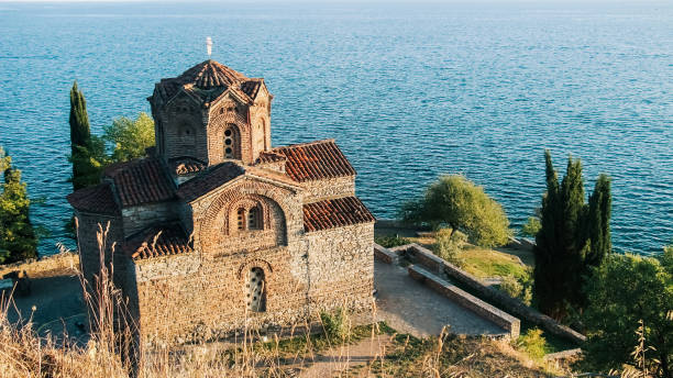 Orthodox Church of St John at Kaneo on a cliff overlooking Ohrid Lake on a sunny afternoon.