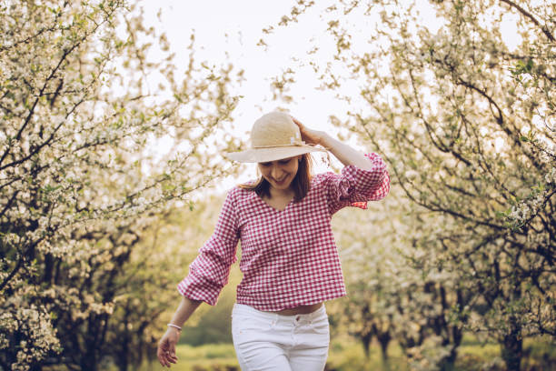 istock Brunette girl in orchard 958237816