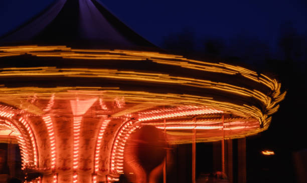 istock beautiful bright carousel in amusement park,night 958241034