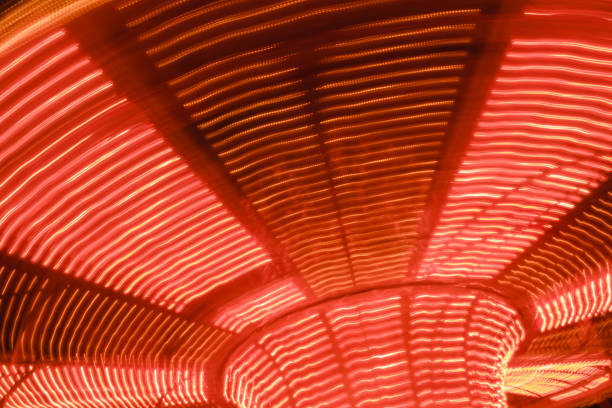 istock beautiful bright carousel in amusement park,night 958241154