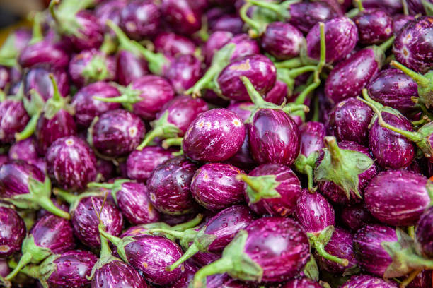 istock Vegetables Stand in Asia with Eggplants 958252354