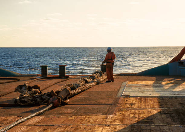 istock AHTS vessel doing static tow tanker lifting. Ocean tug job 958253090