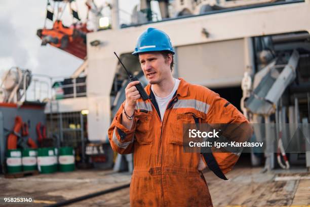 Marine Deck Officer Or Chief Mate On Deck Of Ship With Vhf Radio Stock Photo - Download Image Now