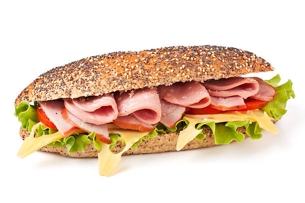 istock Whole wheat baguette with ham, cheese and vegetables 95825860