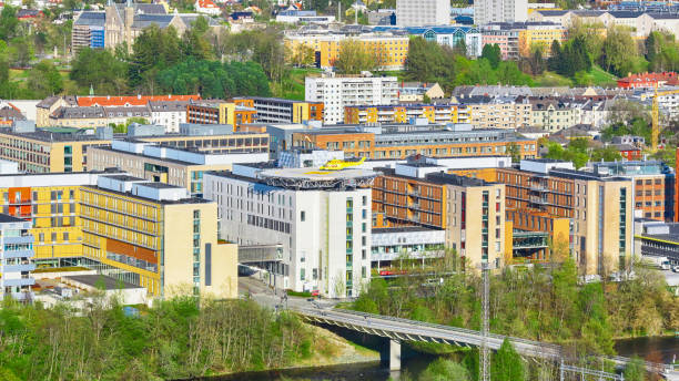 The view of the S.Olav hospital with air ambulance helicopter on the roof in the norwegian city Trondheim.