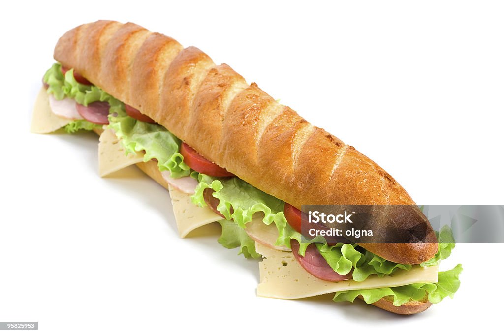 Largo un sándwich de pan francés - Foto de stock de Bocadillo submarino libre de derechos
