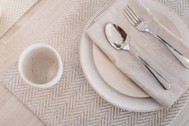 istock dining set with dish and spoon on white clean napkin 958259670