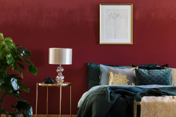 istock Gold and red sophisticated bedroom 958261120