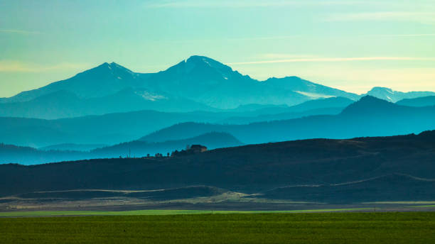 Mountain View View of green farmland on the Colorado front range of the Rocky Mountains front range mountain range stock pictures, royalty-free photos & images