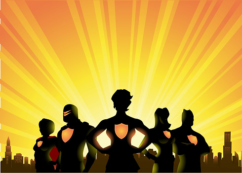 A silhouette style illustration of a team of superheroes with female leader with city skyline and sunburst in the background. Wide space available for your copy.