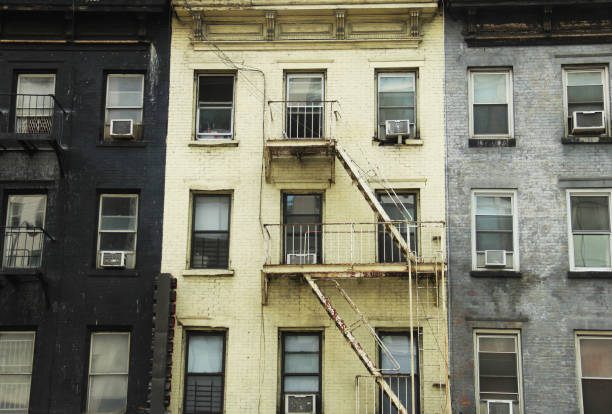 istock Black, Yellow, Grey NYC Apartment Buildings 958272090