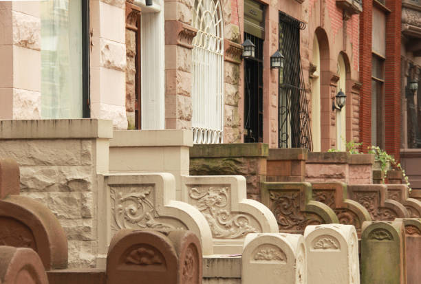 Different colored stoops in front of brownstones on the Upper West Side of Manhattan