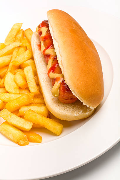 istock hot dog and fries on white plate 95827810