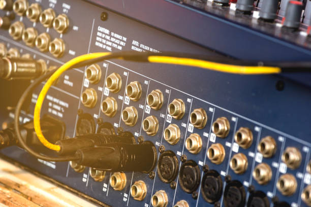 istock Signal cable connected to Audio mixer. 958296036