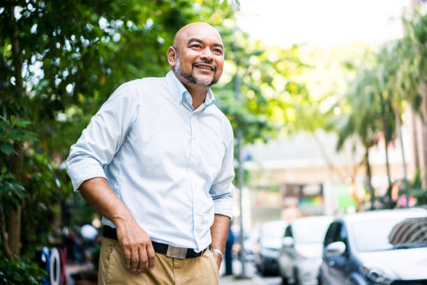 Mid Malaysian man walking in the city