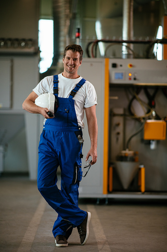 Factory worker. Shallow DOF. Developed from RAW; retouched with special care and attention; Small amount of grain added for best final impression. 16 bit Adobe RGB color profile.