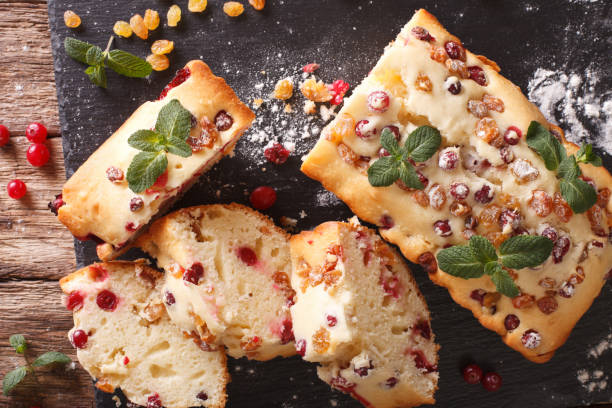 istock Traditional fruit cake with cranberries and raisins close-up. horizontal top view 958308102