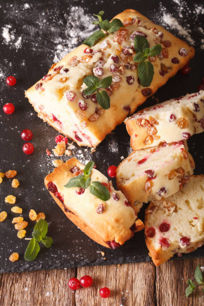 istock sliced fruit cake with cranberries and raisins decorated with mint close up. vertical 958308200