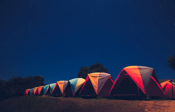 istock Glowing tent in the mountains under a starry sky 958312764