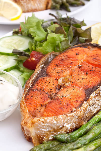 istock salmon with vegetables,lemon and sauce 95831333