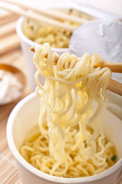 istock ramen noodles raised on chopsticks 95831606