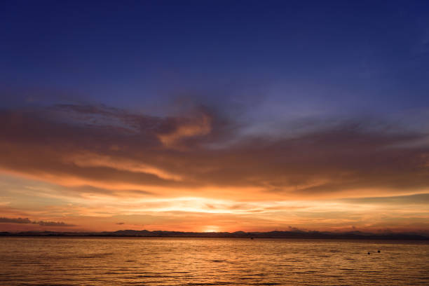 istock dramatic sky sunset time in golden hour ,nature background 958316356