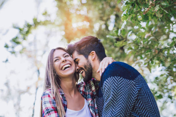 Happy and in love Happy couple in love having fun outdoors and smiling. young couple stock pictures, royalty-free photos & images