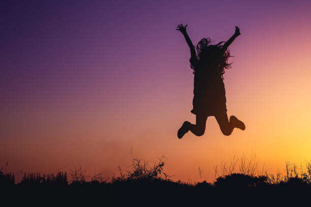 istock umbrella girl silhouette at sunset on  vintage  backdrop 958327834