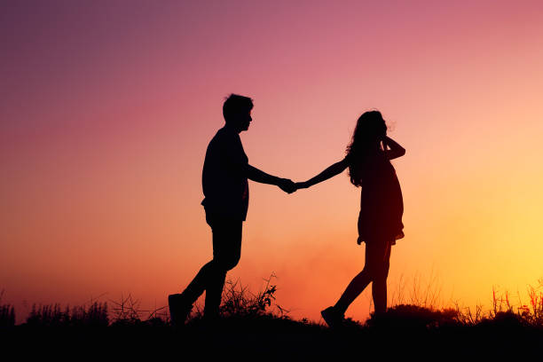 istock umbrella girl silhouette at sunset on  vintage  backdrop 958327868