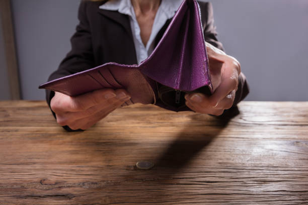 istock Businessperson Holding Empty Purse 958332362