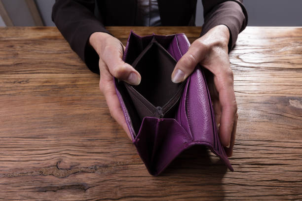 istock Businessperson Holding Empty Purse 958332376