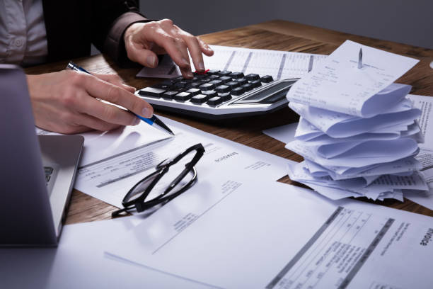 istock Businessperson Calculating Invoice 958332384