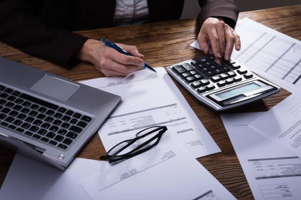 istock Businessperson Calculating Invoice 958332386