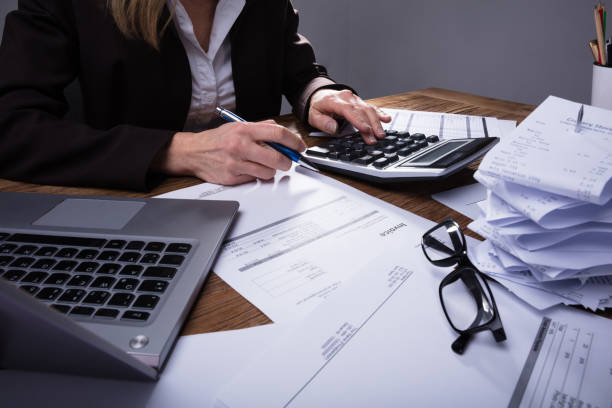 istock Businessperson Calculating Invoice 958332388