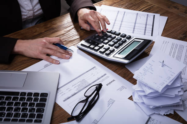 istock Businessperson Calculating Invoice 958332390
