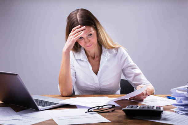 istock Sad Businesswoman Sitting In Office 958332406