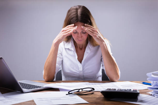 istock Businesswoman Suffering From Headache 958332414