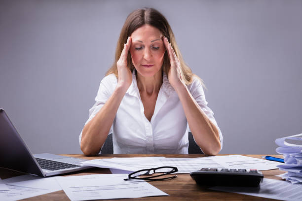 istock Businesswoman Suffering From Headache 958332428