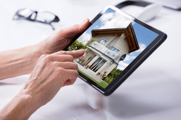 istock Close-up Of A Person's Hand Holding Digital Tablet 958332890