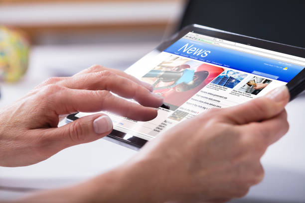 istock Close-up Of A Person's Hand Using Digital Tablet 958332892