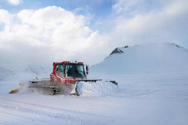 istock snowcat rides to work in the evening 958332930