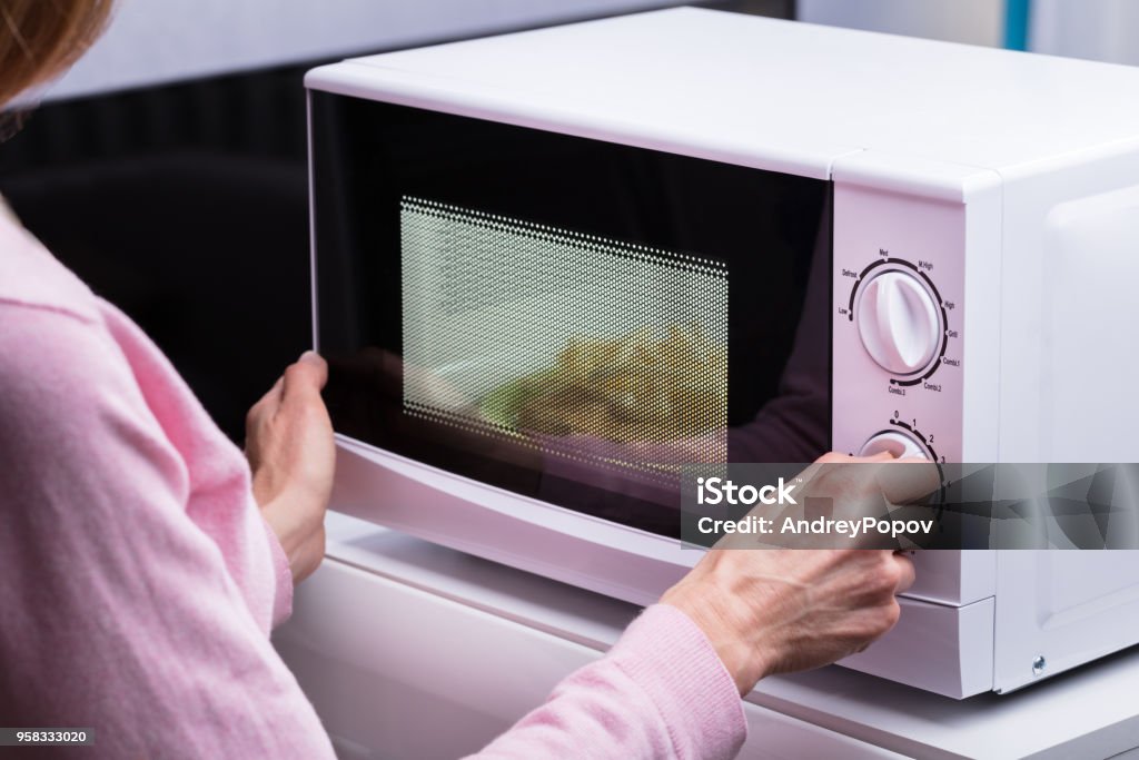 Heating Food in a Microwave Oven Stock Photo - Image of kitchen, door:  236057510