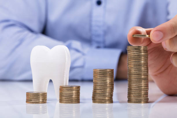 Stack Of Coins In Front Of Healthy Tooth