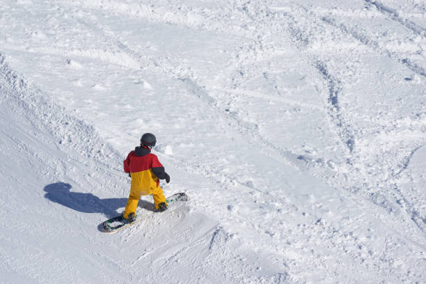 istock freeride snowboarder kicks off the track, 958336424