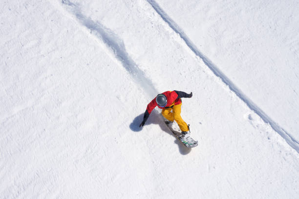 Snowboarder riding on loose snow Freeride stock photo