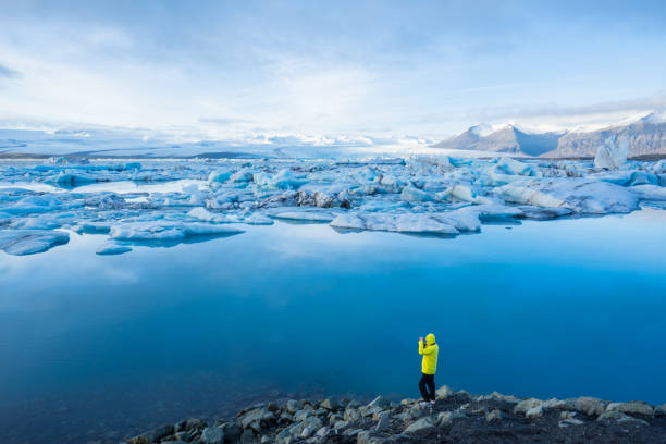 istock Hiking man arms open facing to the Tranquil Scene 958339782